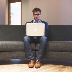 Man, laptop, businessman — Social Security Helping Citizens Navigate Benefit Options With Confidence